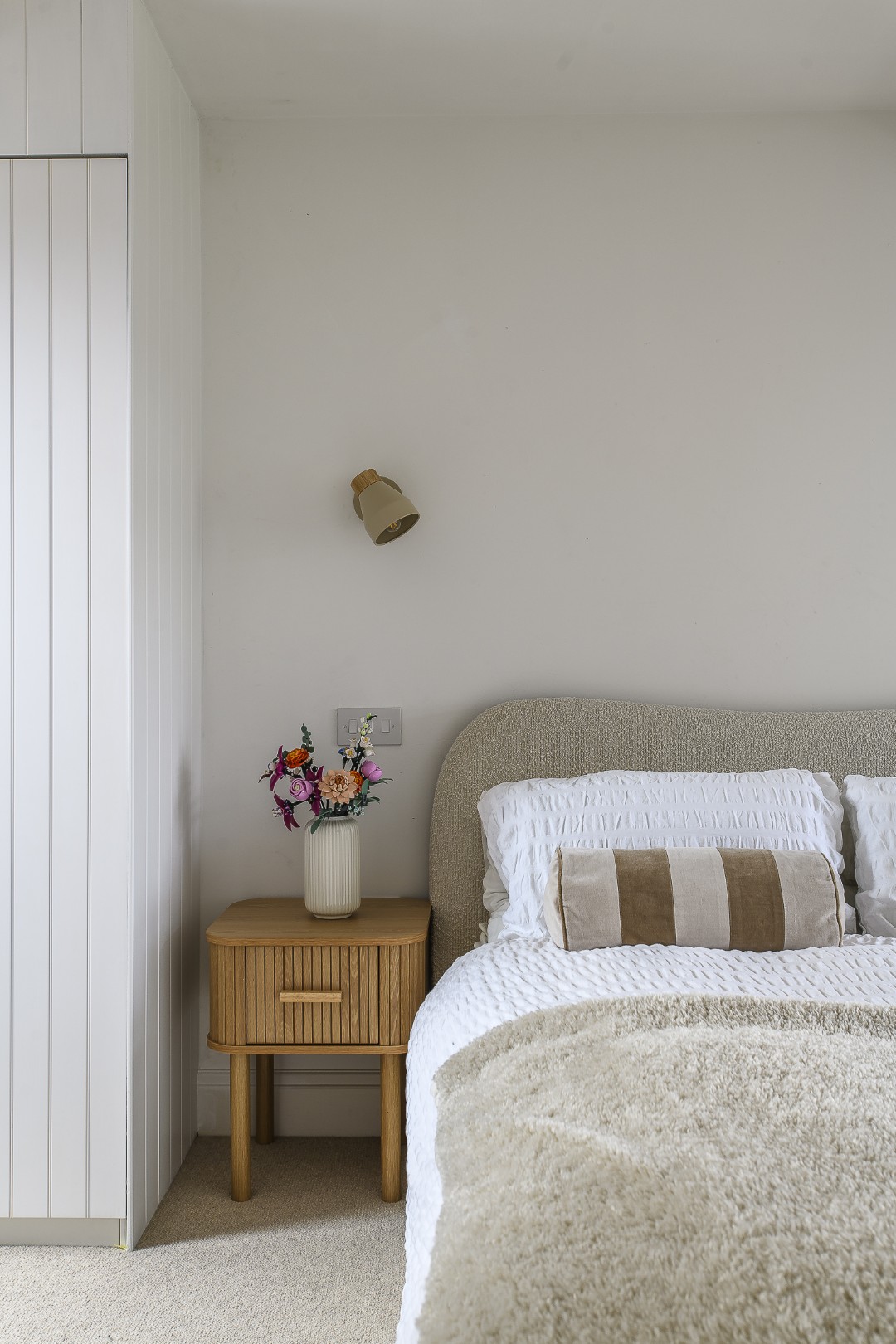 At the top of the house, Amie and Jon’s daughter’s room is a light and private space where the colour palette has been kept soft and Scandinavian-inspired.