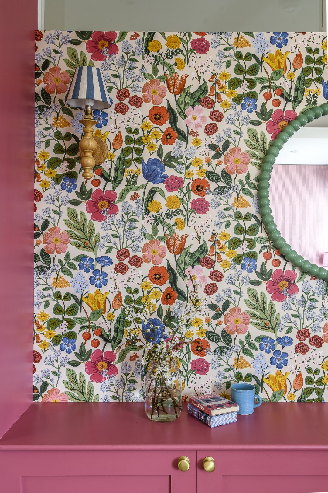 Amie’s office is papered in Rife Paper Co Third Edition Blossom, with woodwork and cabinetry painted a strong Rhubarb by Paint & Paper Library