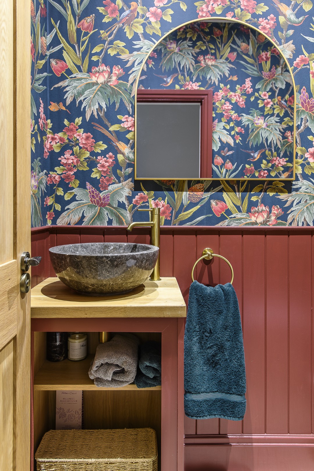 The downstairs loo, papered in Warner House’s Fleurs Exotique, is bold, playful and unapologetically decorative
