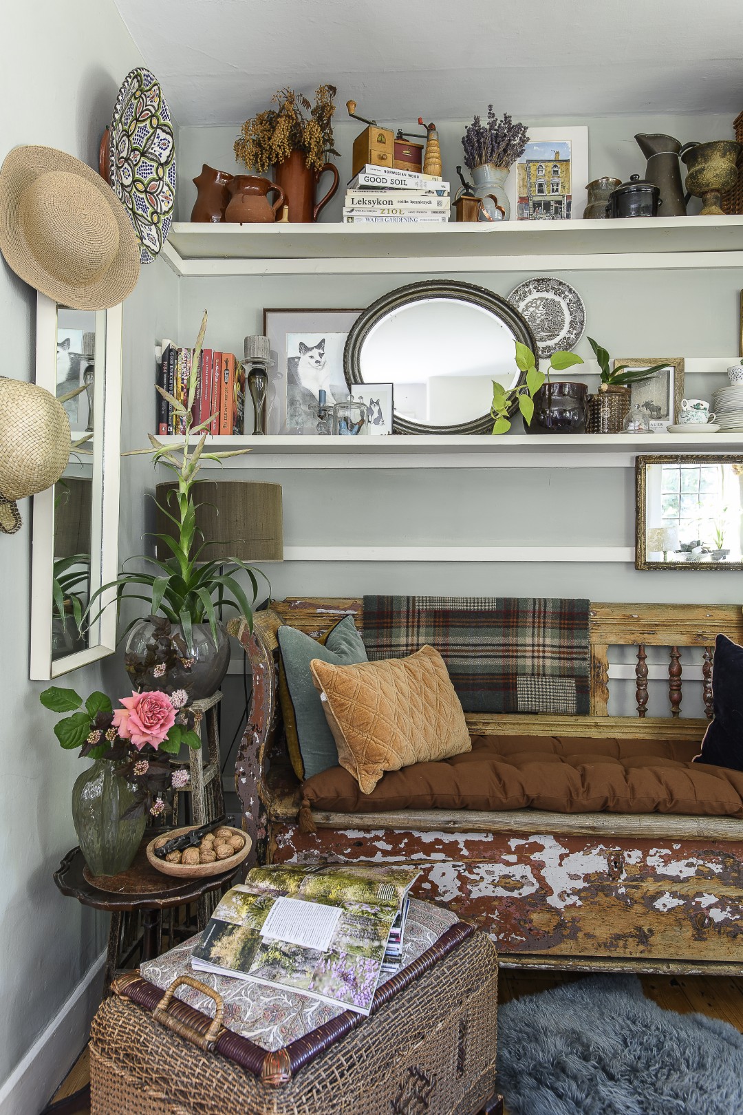 Objects to peruse line shelving in the sitting and dining rooms