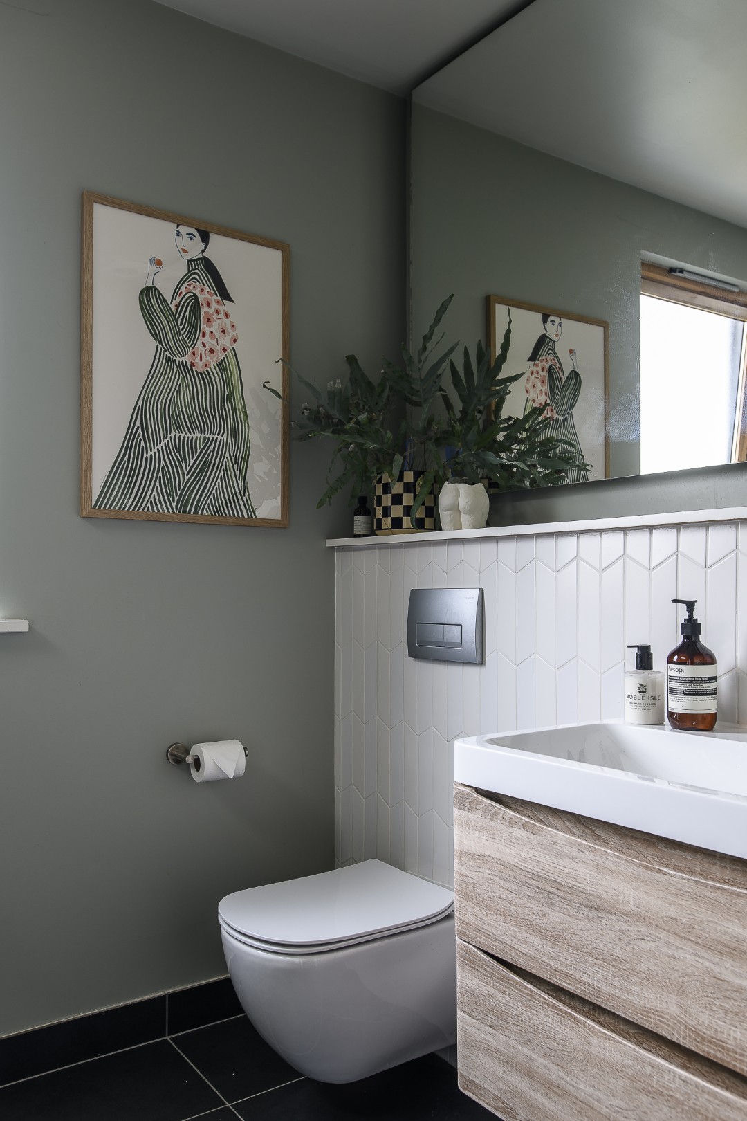 In the principal en suite, a framed print from PSTR Studio hangs in one corner, whilst a roof light above the shower provides the ultimate in privacy.