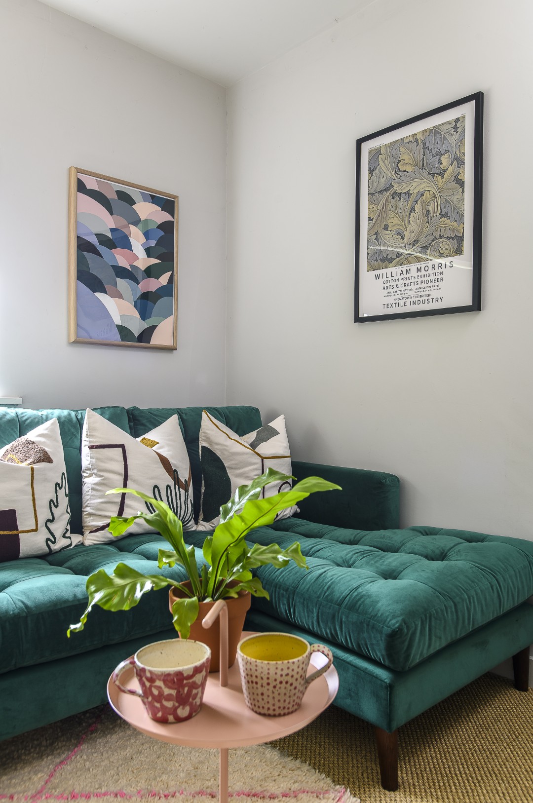 The living space, where a Loaf sofa is piled with Scandi inspired cushions and throws.