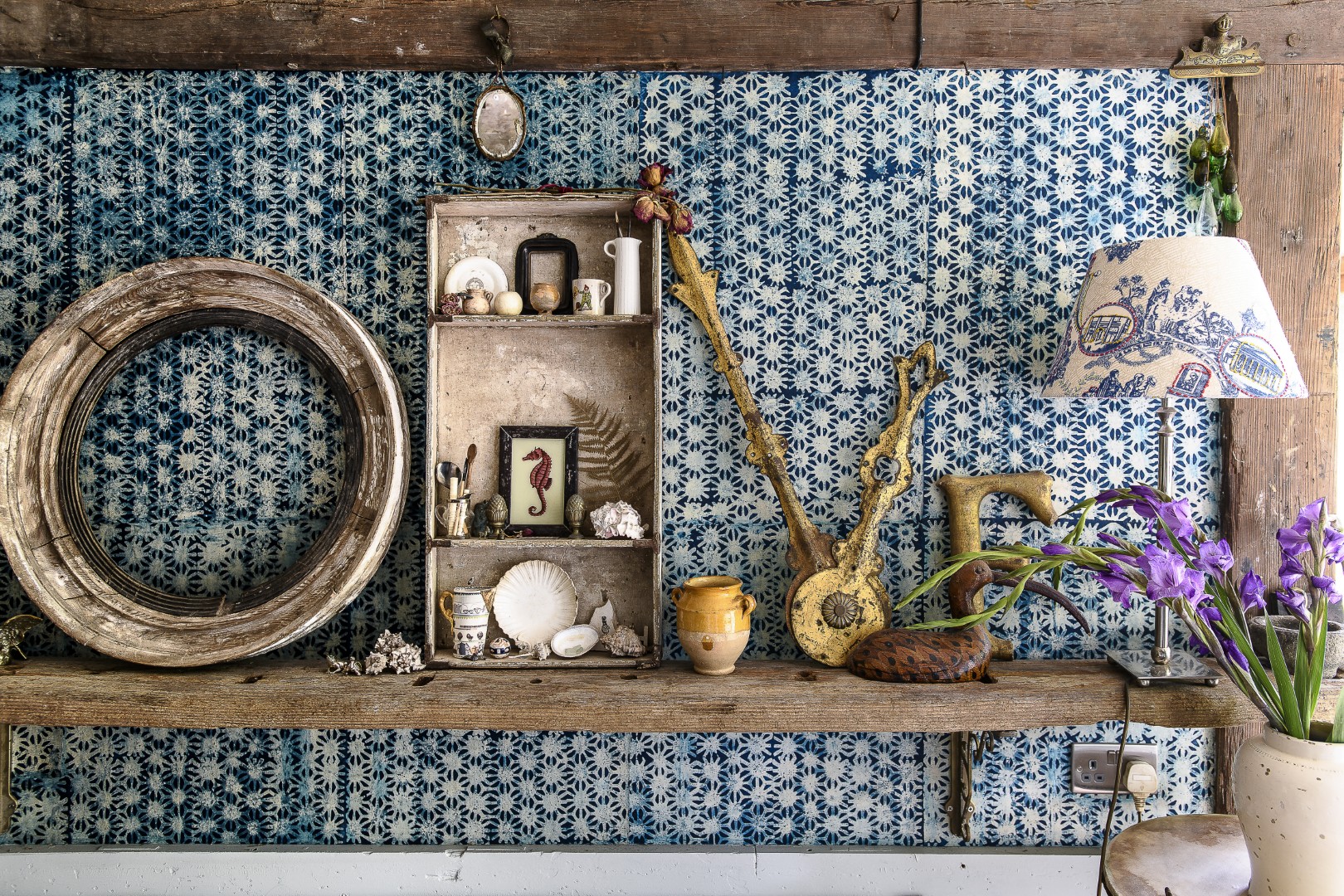 The walls here are papered in a unique wallcovering made from rice leaves printed using the batik technique, the perfect backdrop for more treasured finds.