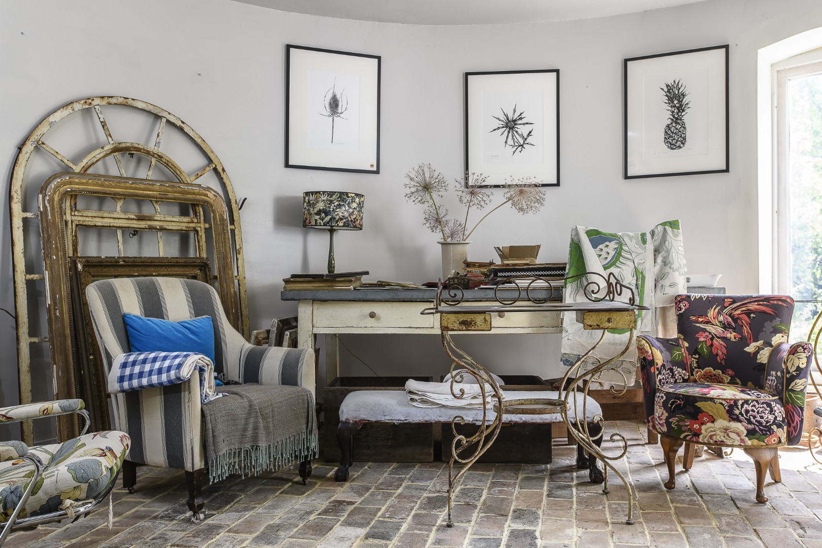In a passage that runs underneath the stairs is a storage area, home to an old drapers unit with over thirty drawers.