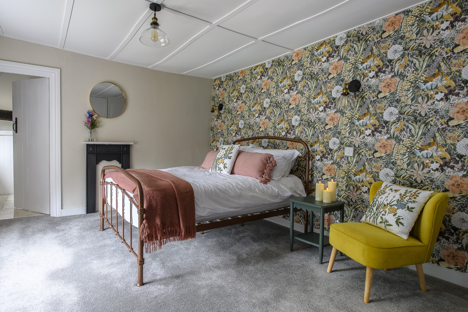 The meadows that surround the estate have been echoed in the wallpaper of one of the bedrooms