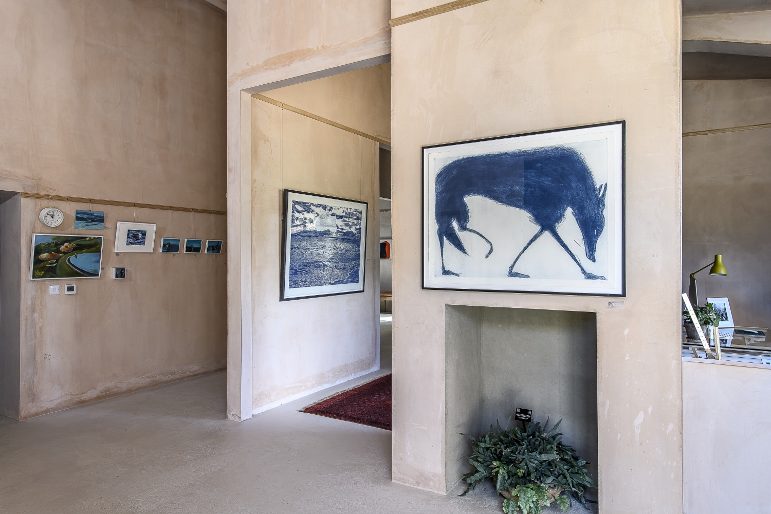 'Blue Wolf’ by Kate Boxer hangs next to pieces by Trevor Price and Vanessa Brassey
