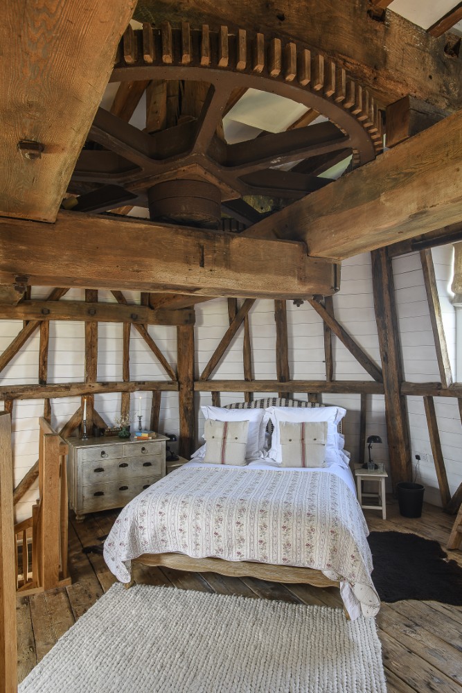 The second to top floor houses a memorable bedroom, complete with the great spur wheel