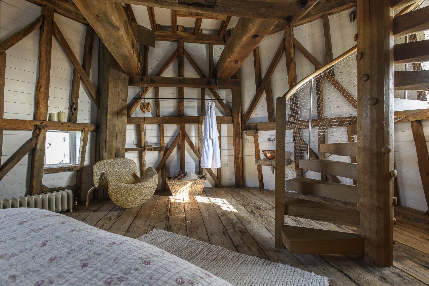 The second to top floor houses a memorable bedroom, complete with the great spur wheel