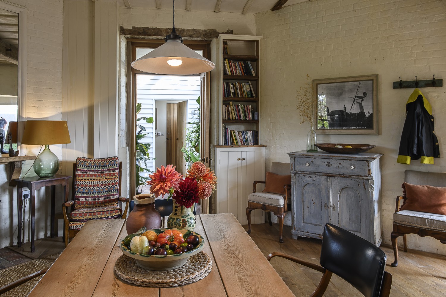 The ground floor kitchen and living area leads through to a separate building that houses the bedroom, linked by a glazed walkway